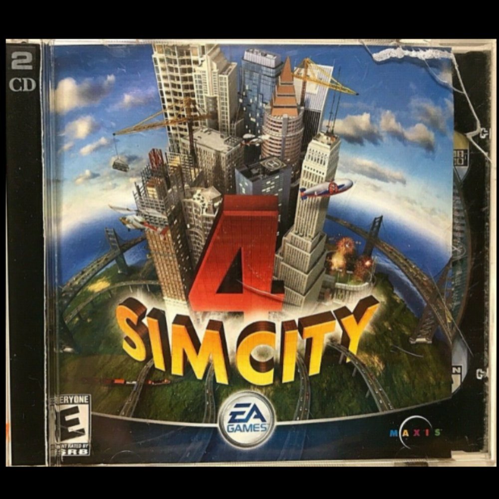 Sim City 4 PC CD-ROM Game 2 Disk Set Vintage EA Games 2003 Very Good Condition